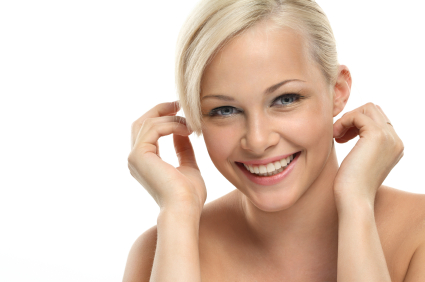 A smiling patient after getting simultaneous dental implants with a sinus lift from Solutions Dental Implants in Sun City West, AZ