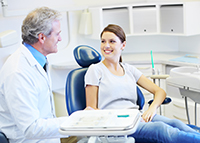 Our dentist going over pre-perative instructions for dental implants with a patient at Solutions Dental Implants in Sun City West, AZ