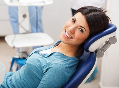 a smiling patient who will be getting bone morphogenetic proteins from Solutions Dental Implants 