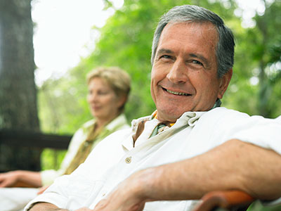 Patient smiling after getting soft tissue regeneration at Solutions Dental Implants in Sun City West, AZ Patient smiling after getting soft tissue regeneration at Solutions Dental Implants in Sun City West, AZ